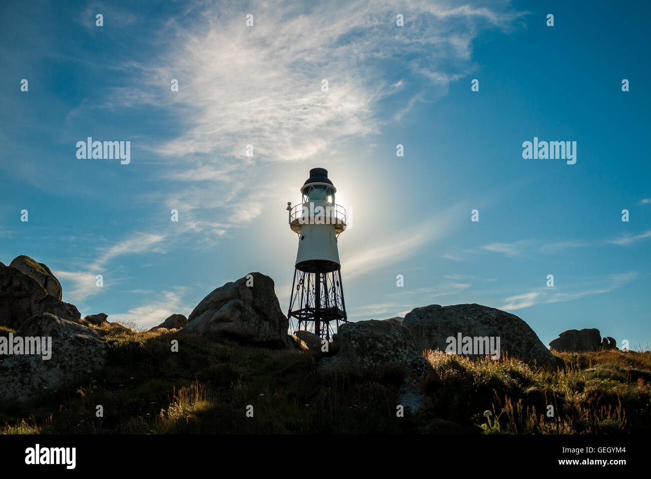 Penninis lighthouse halo of sun, St Mary's, Isles of Scilly Stock Photo