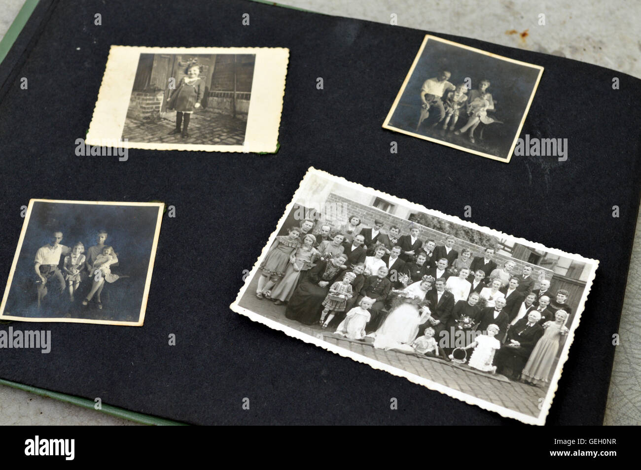 Photo album with old black and white family photos. Stock Photo