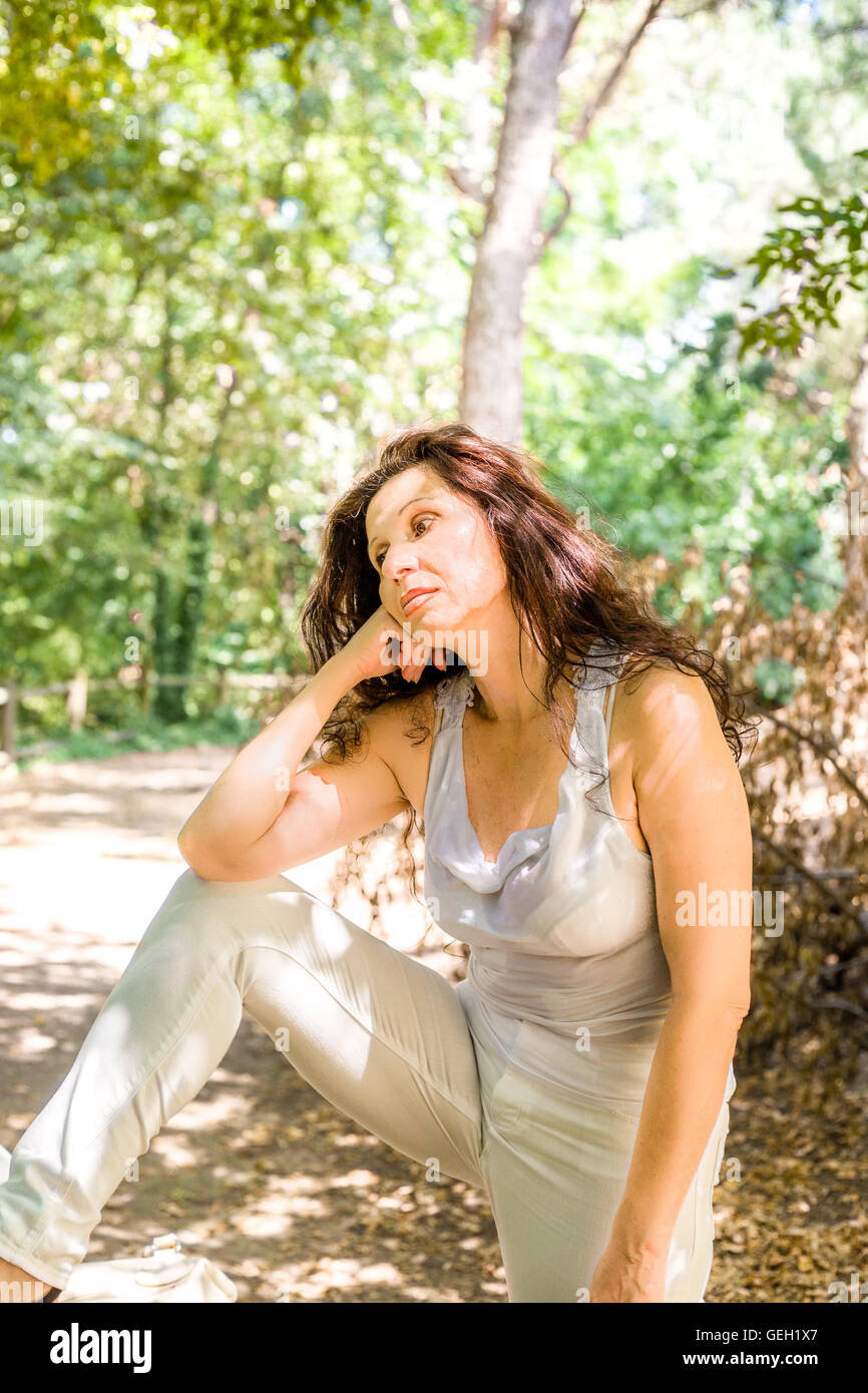 Woman knees looking at camera hi-res stock photography and images - Alamy