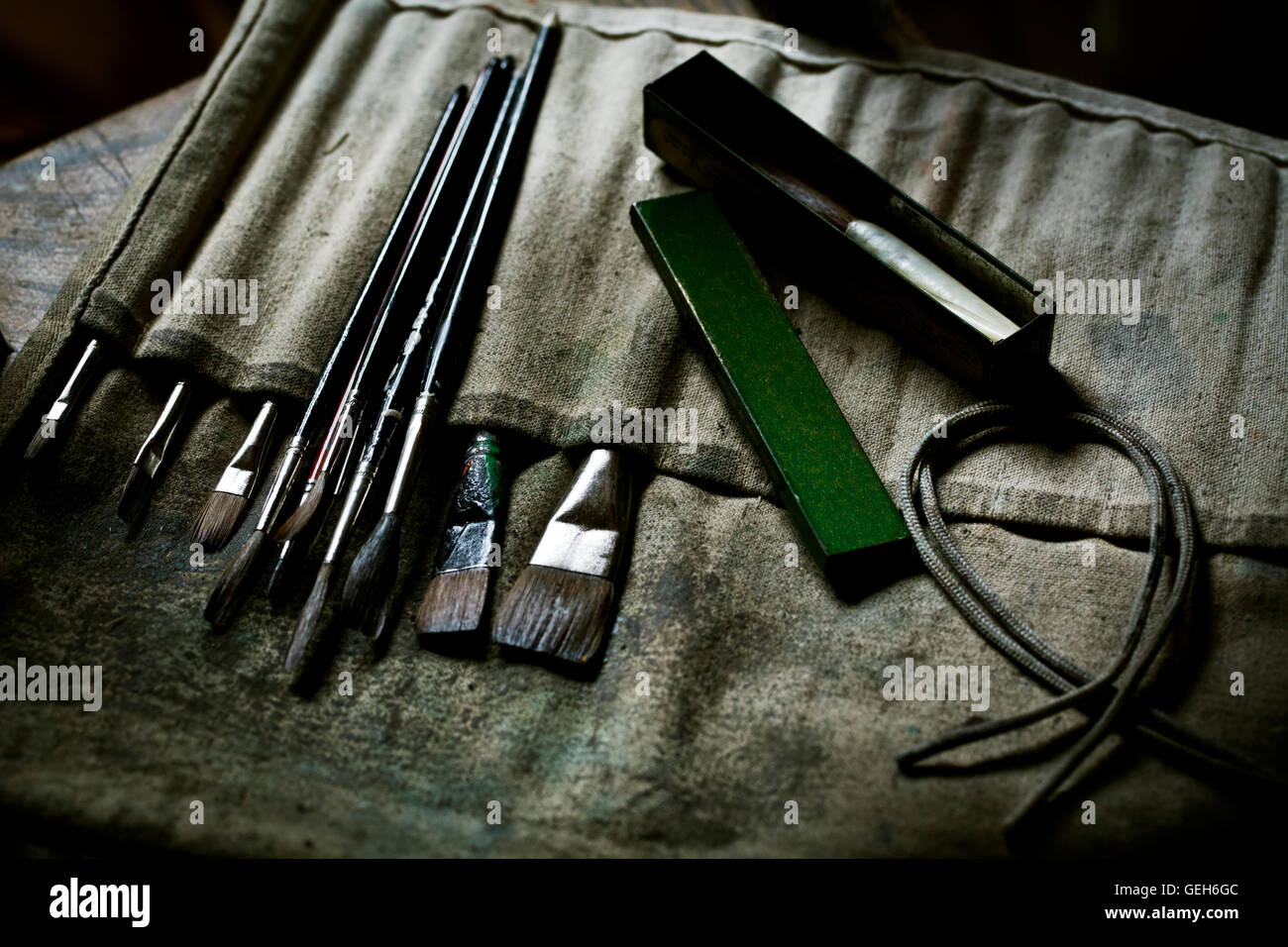 A row of paint brushes and hand tools. Stock Photo