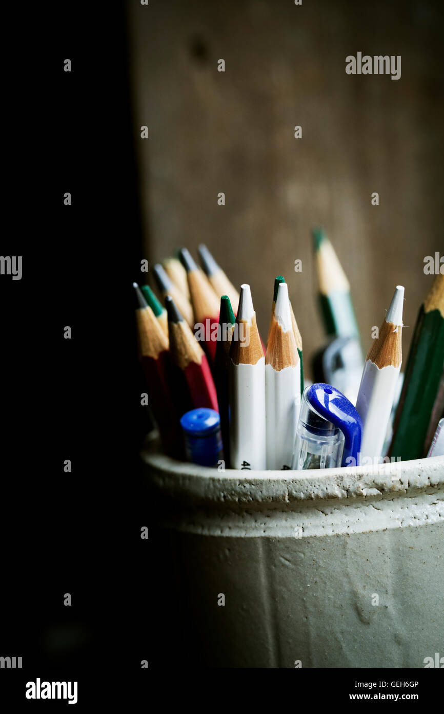 A pot of sharpened coloured lead pencils. Stock Photo