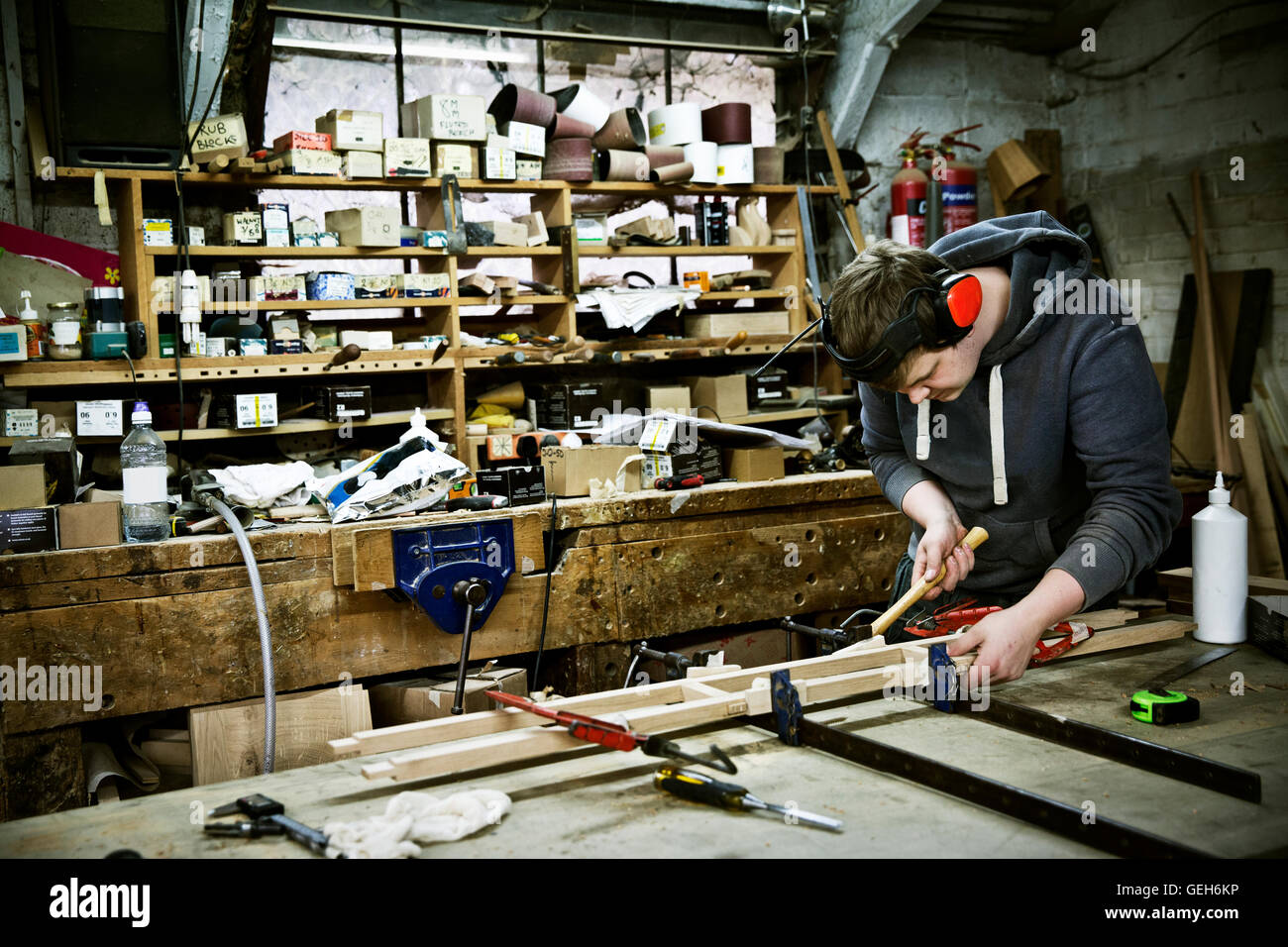 A man working in a furniture maker's Stock Photo Alamy