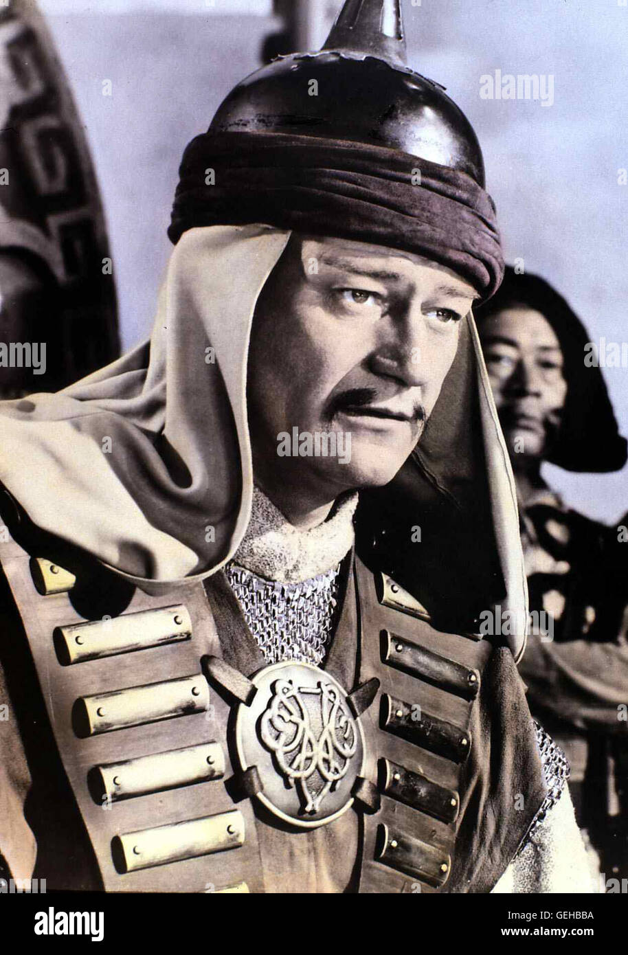 John Wayne   Bei einem Ueberfall auf eine Karawane nimmt der Mongolenfuehrer Temujin (John Wayne) die Tataren-Prinzessin Bortai gefangen. *** Local Caption *** 1956, Conqueror, The, Der Eroberer Stock Photo