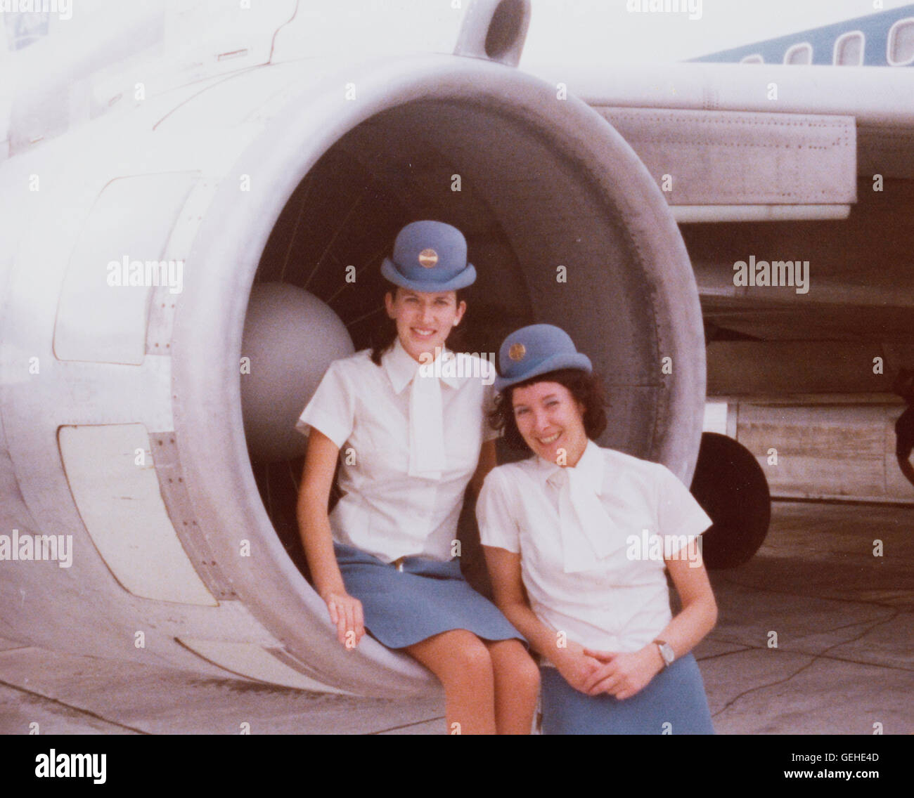 1970s Picture of Two Pan American Airways Stewardesses in a 707 Jet Engine Intake Stock Photo