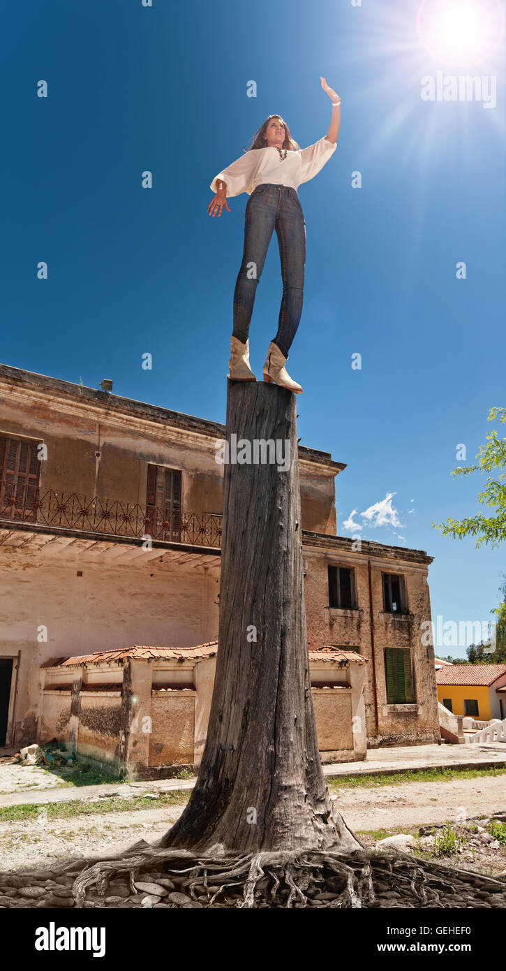 Woman standing in statuesque pose hires stock photography and images