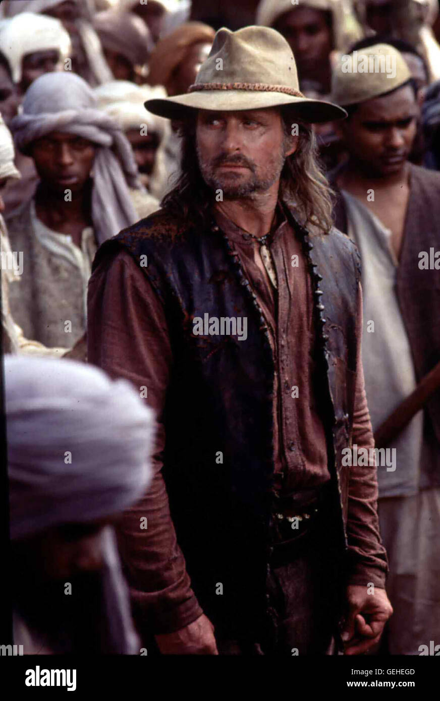 Michael Douglas Der Jaeger Remington (Michael Douglas) will dem Spuk ein Ende bereiten und die beiden, bei den Einheimischen als boese Daemonen erkannte, Loewen zu erlegen. *** Local Caption *** 1996, Ghost And The Darkness, The, Der Geist Und Die Dunkelh Stock Photo