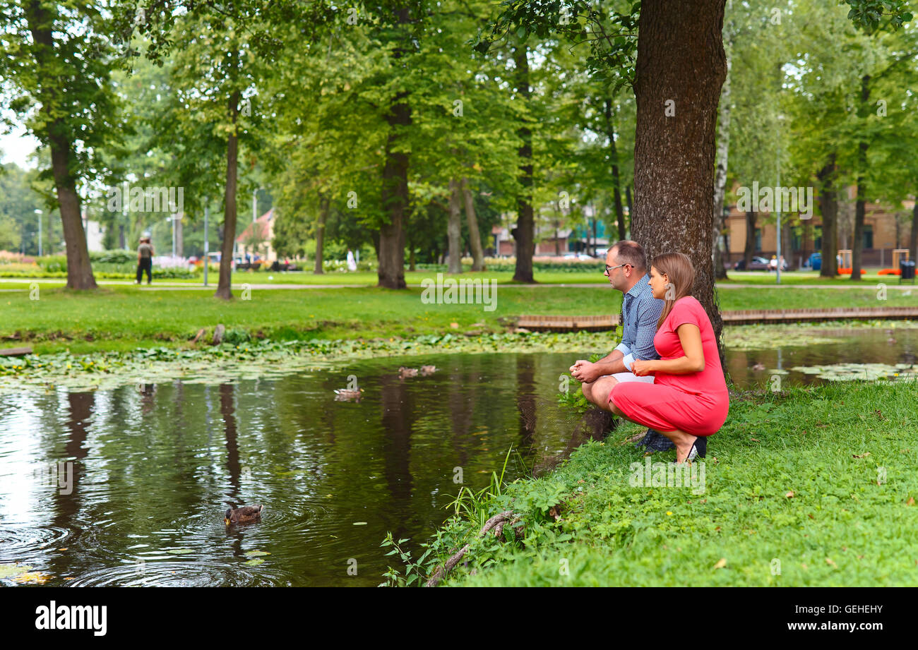 pregnant woman walking with her husband in park Stock Photo - Alamy