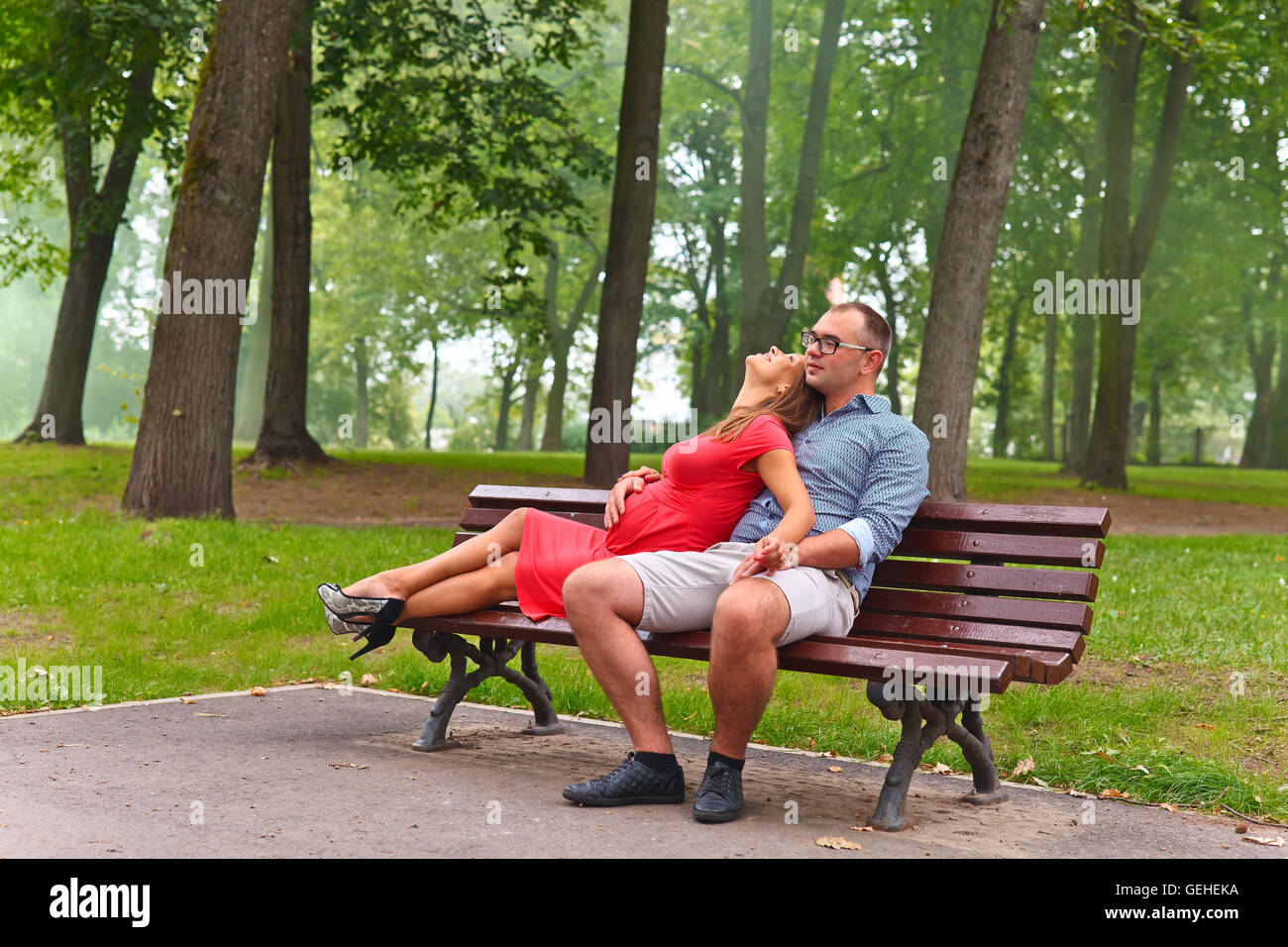 pregnant woman walking with her husband in park Stock Photo - Alamy