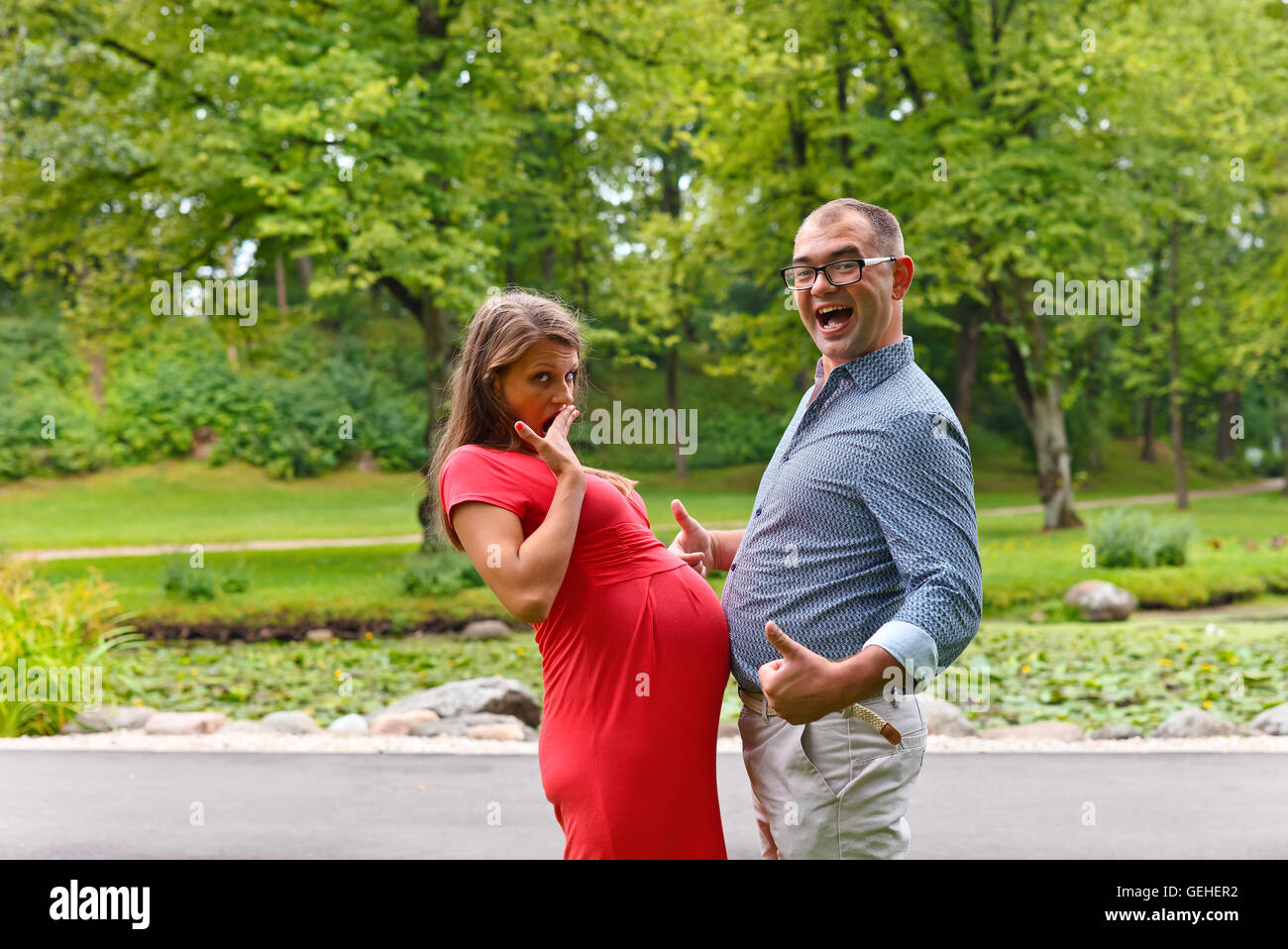 pregnant woman walking with her husband in park Stock Photo - Alamy