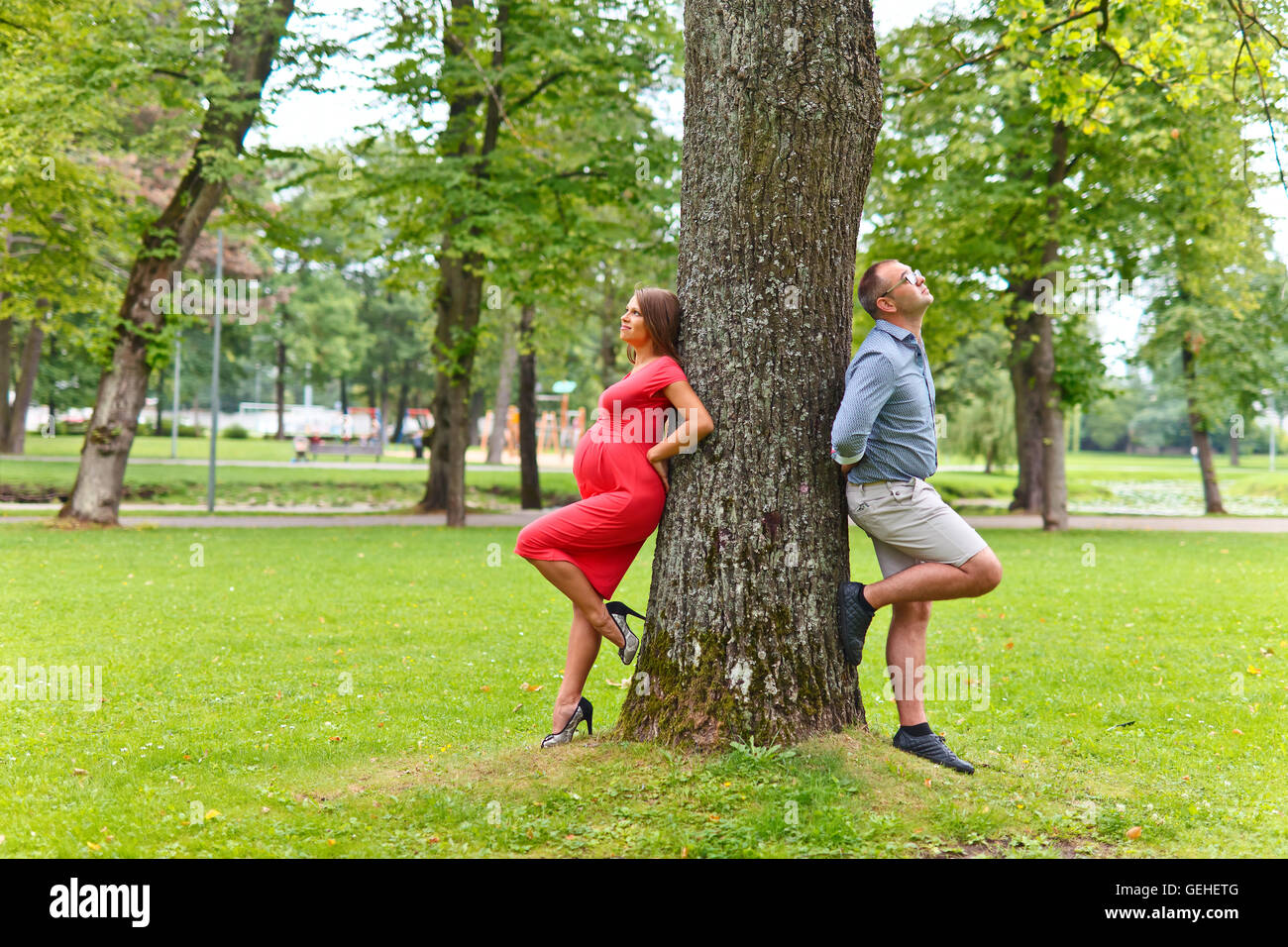 pregnant woman walking with her husband in park Stock Photo - Alamy