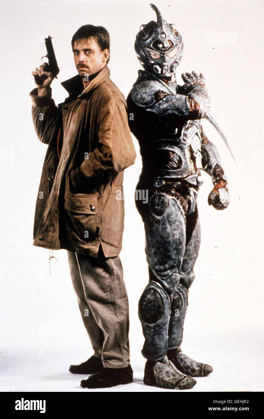 Mark Hamill CIA-Agent Max Reed (Mark Hamill) mit Reptil-Mutant