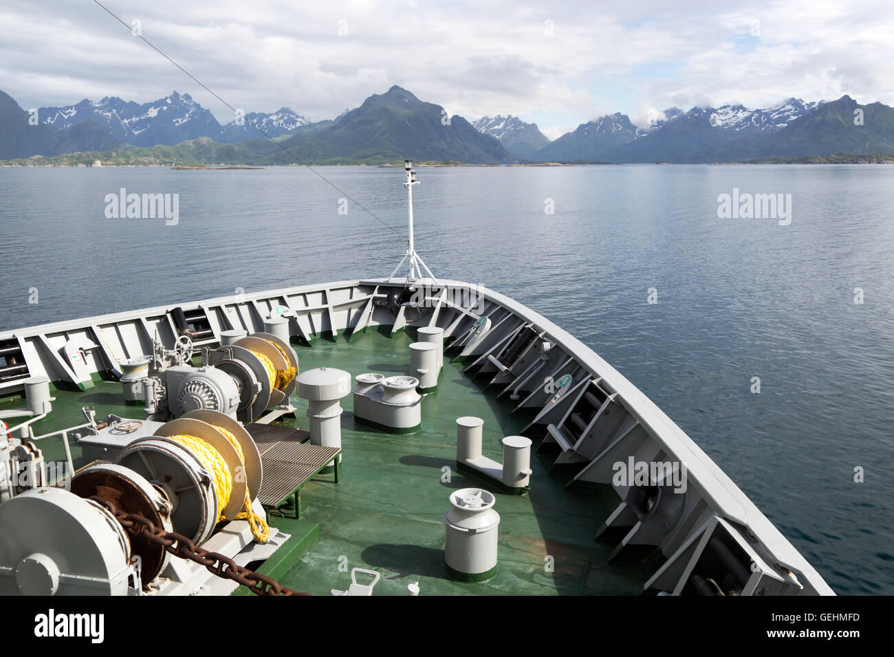 Hurtigruten ferry ship approaching the southern coast of Hinnoya Island, Nordland, northern Norway Stock Photo