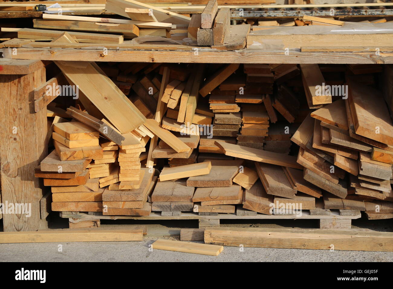Lumber. Carpentry table full of rough planks, lumber pieces. New lumbers, construction Lumbers, wood planks, raw planks Construction material. Stock Photo