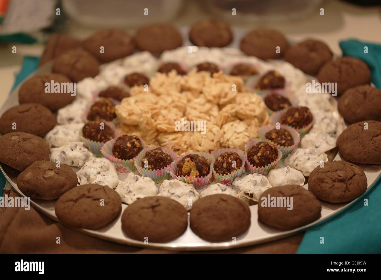 Cookies in a Silver plate. Round silver plate with variety of homemade cookies. Set of cookies in lines for the traditional Pesach festive meal. Stock Photo