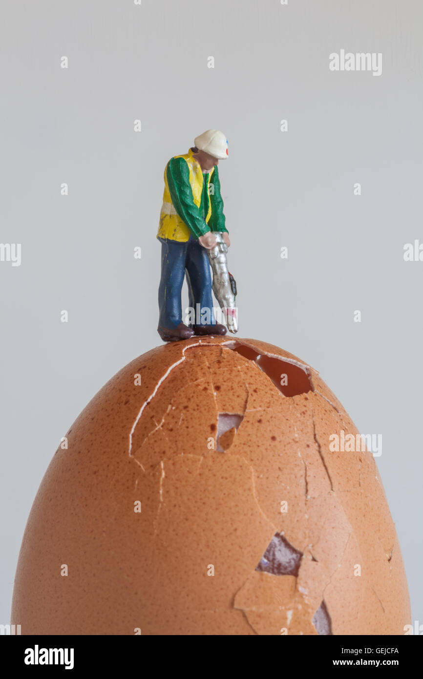 Model Railway Workman Digging Into Egg Stock Photo