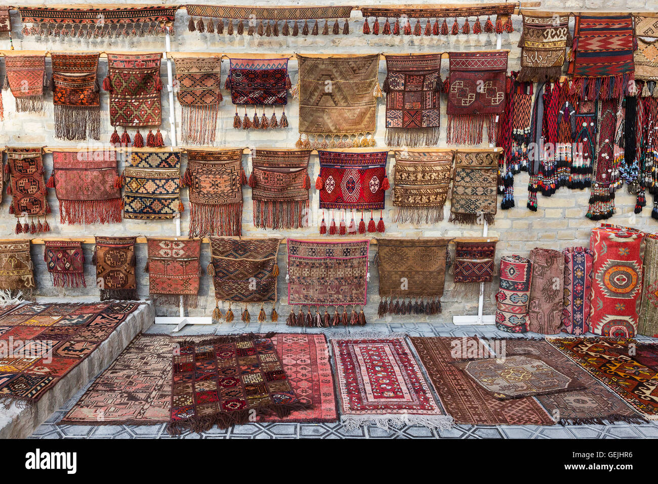 Colorful oriental rugs outside of a shop in Bukhara, Uzbekistan. Stock Photo
