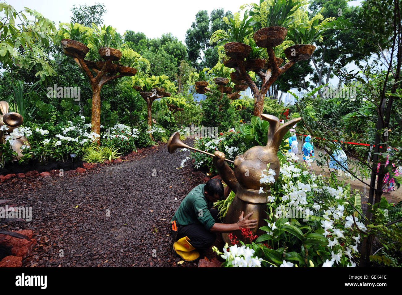 Singapore. 26th July, 2016. A staff member works at the Singapore Garden Festival in Singapore's Gardens by the Bay, July 26, 2016. Singapore Garden Festival, which showcases creations from the world's award-winning garden and floral designers, enters the fourth day of exhibition at Singapore's Gardens by the Bay on Tuesday. Credit:  Then Chih Wey/Xinhua/Alamy Live News Stock Photo