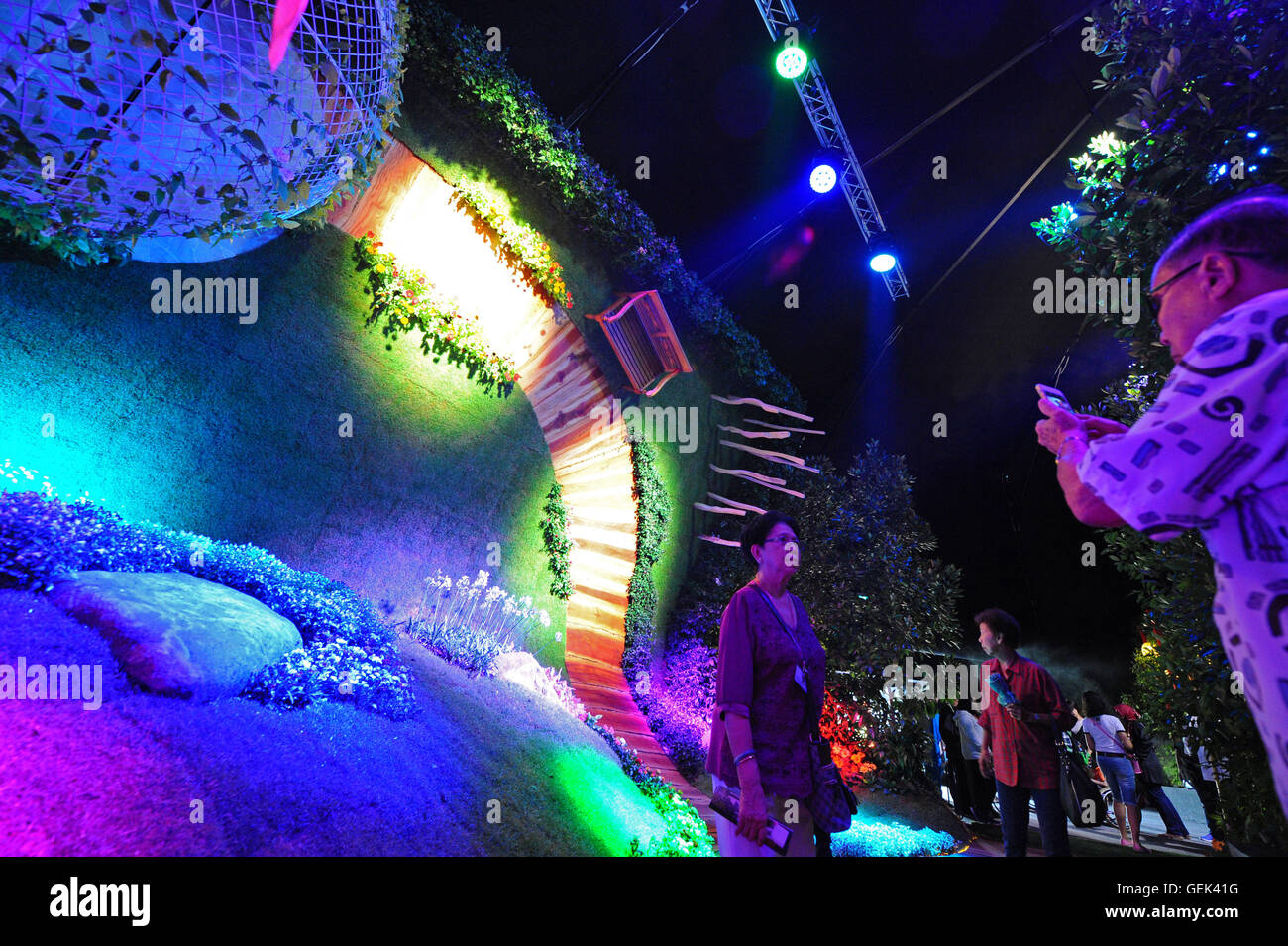 Singapore. 26th July, 2016. Visitors take photos at the Singapore Garden Festival in Singapore's Gardens by the Bay, July 26, 2016. Singapore Garden Festival, which showcases creations from the world's award-winning garden and floral designers, enters the fourth day of exhibition at Singapore's Gardens by the Bay on Tuesday. Credit:  Then Chih Wey/Xinhua/Alamy Live News Stock Photo