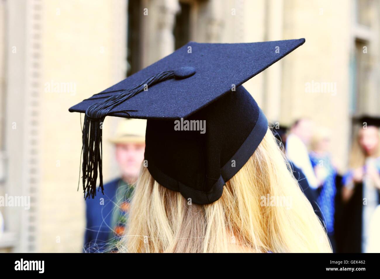 Brighton, UK. 25th July, 2016. A Brighton University graduate wearing the traditional mortar board and cloak leaves the graduati Stock Photo
