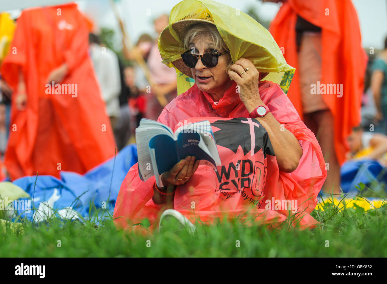 Krakow, Poland. 26th Jul. 2016. Pilgrims from all over the world arrived to Krakow to celebrate World Youth Day 2016. People celebrate the holy mass at the inauguration of WYD in Blonia Park. Credit:  Beata Zawrzel/Alamy Live News Stock Photo