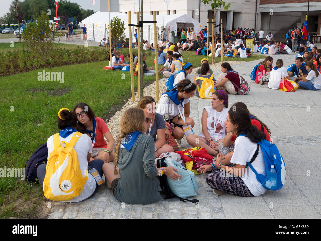 Krakow, Poland. 26th July, 2016. World Youth Day 2016. Young people from various countries sitting on the ground and talking in small groups around the Sanctuary of Pope John Paul II. Credit:  Krzysztof Nahlik/Alamy Live News Stock Photo