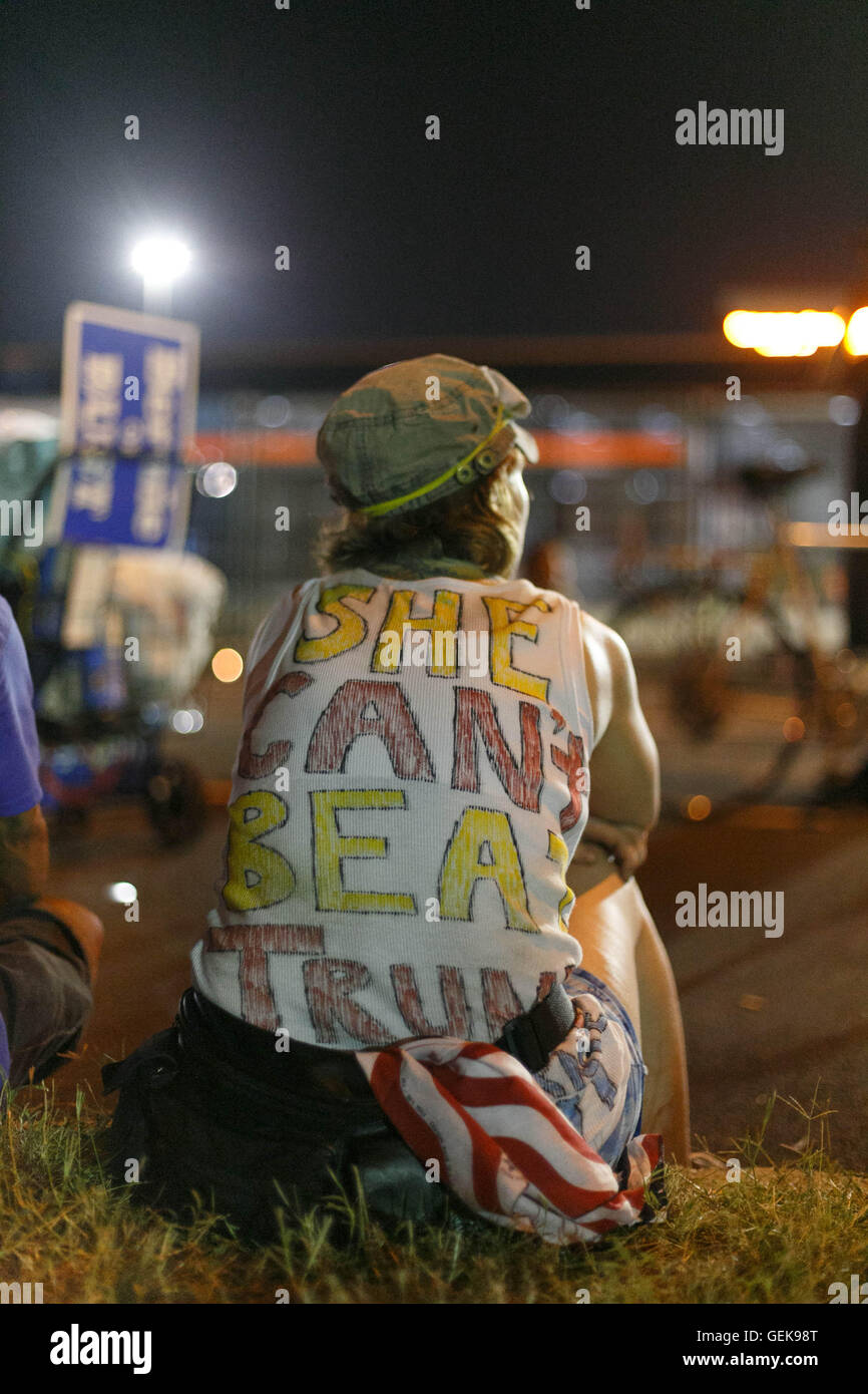 Philadelphia, Pennsylvania, USA. 26th July, 2016. Democratic National Convention. A Bernie Sanders supporters sits outside of the DNC, wearing a shirt that says 'She can't beat Trump.' Credit:  John Orvis/Alamy Live News Stock Photo