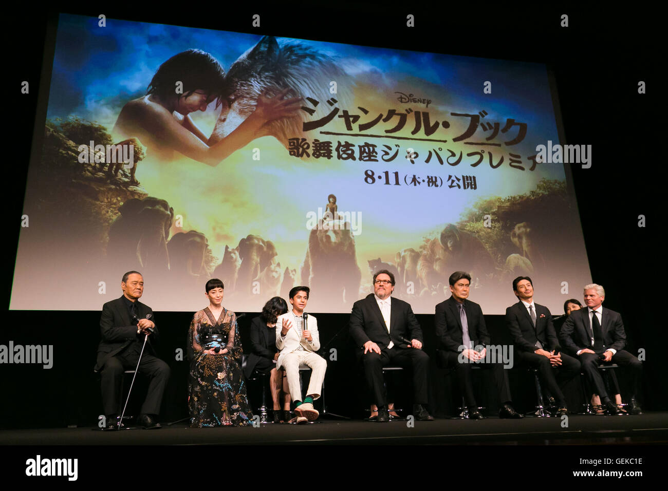 Tokyo, Japan. 27th July, 2016.  (L to R) Actor Toshiyuki Nishida, actress Rie Miyazawa, child actor Neel Sethi, director Jon Favreau, actor Matsumoto Koshiro, actor Yusuke Iseya and producer Brigham Taylor speak during the Japanese premiere for the film The Jungle Book at Kabuki-za theater in Ginza on July 27, 2016, Tokyo, Japan. Sethi, Taylor and Japanese voice cast appeared on the stage to greet the fans. The movie will be released in Japan on August 11. Credit:  Rodrigo Reyes Marin/AFLO/Alamy Live News Stock Photo