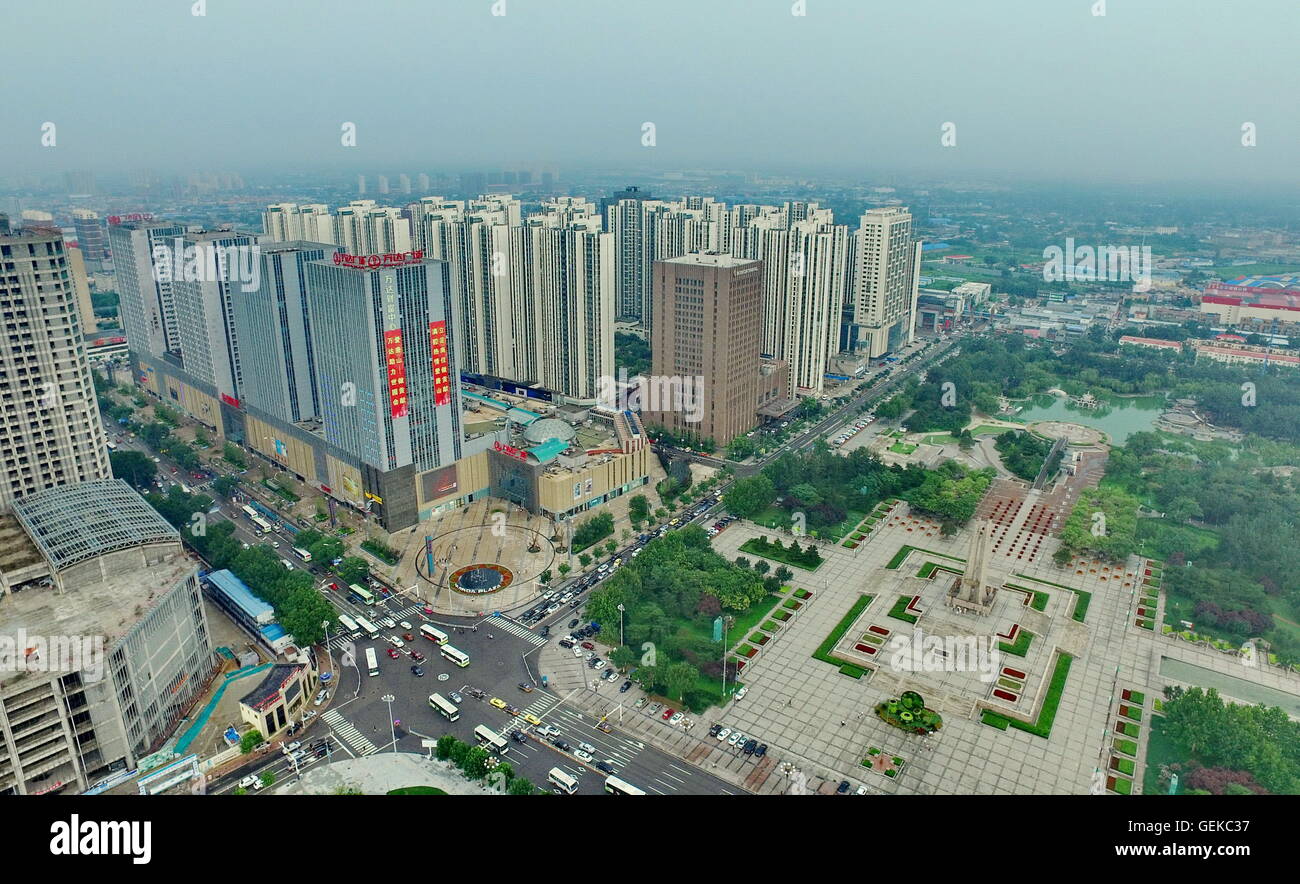 (160727) -- TANGSHAN, July 27, 2016 (Xinhua) -- Photo taken on July 25, 2016 shows aerial view of buildings near the Earthquake Monument in downtown Tangshan, north China's Hebei Province. In the early hours of July 28, 1976, one of the deadliest earthquakes of the 20th century toppled Tangshan, killing more than 240,000 people and injuring another 160,000. The deadly earthquake leveled Tangshan in just 23 seconds, with 96 percent of the city's architecture generally destroyed. Yet Tangshan has been building a miracle on its debris ever since. By the year 2015, the per capita gross national pr Stock Photo