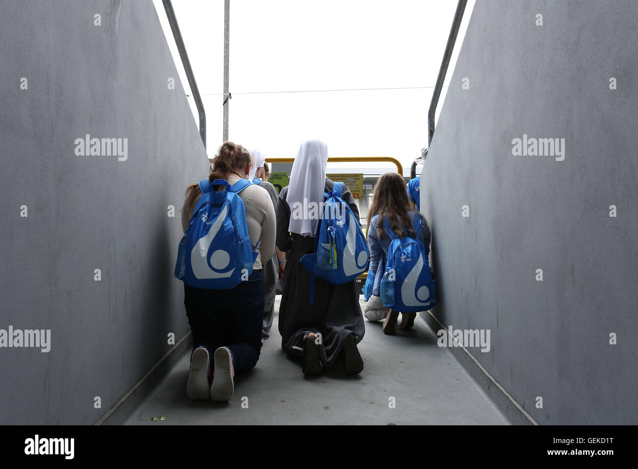 Krakow, Poland, 27th July 2016: Young people gather to the World Youth Day. Preperations started for the Holy Mass in Cracow Blonie  Credit: Madeleine Ratz/Alamy Live News Stock Photo