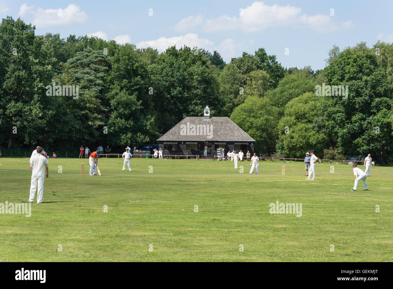 Cricket match on The Green, Pirbright, Surrey, England, United Kingdom Stock Photo