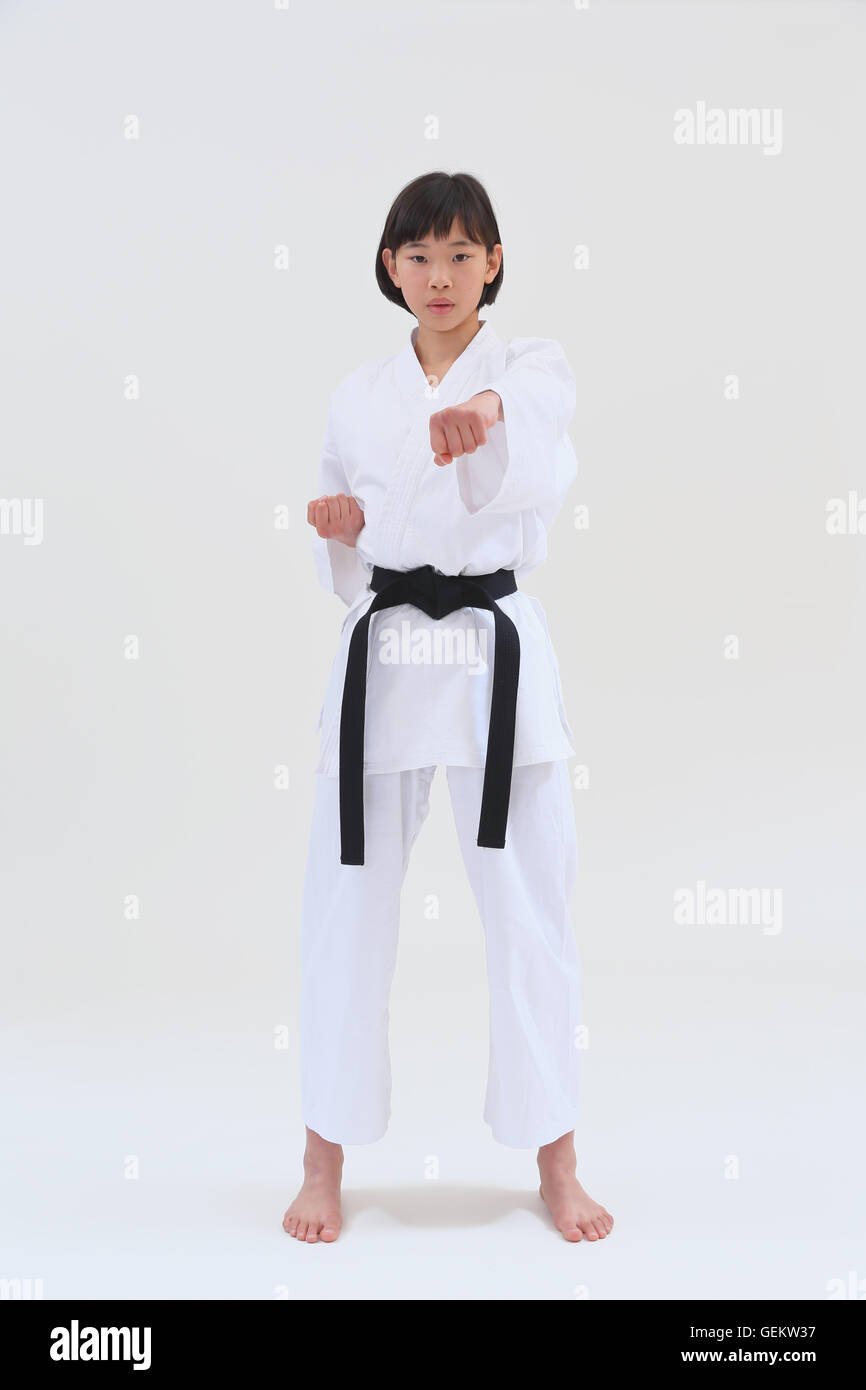 Japanese kid in karate uniform on white background Stock Photo Alamy