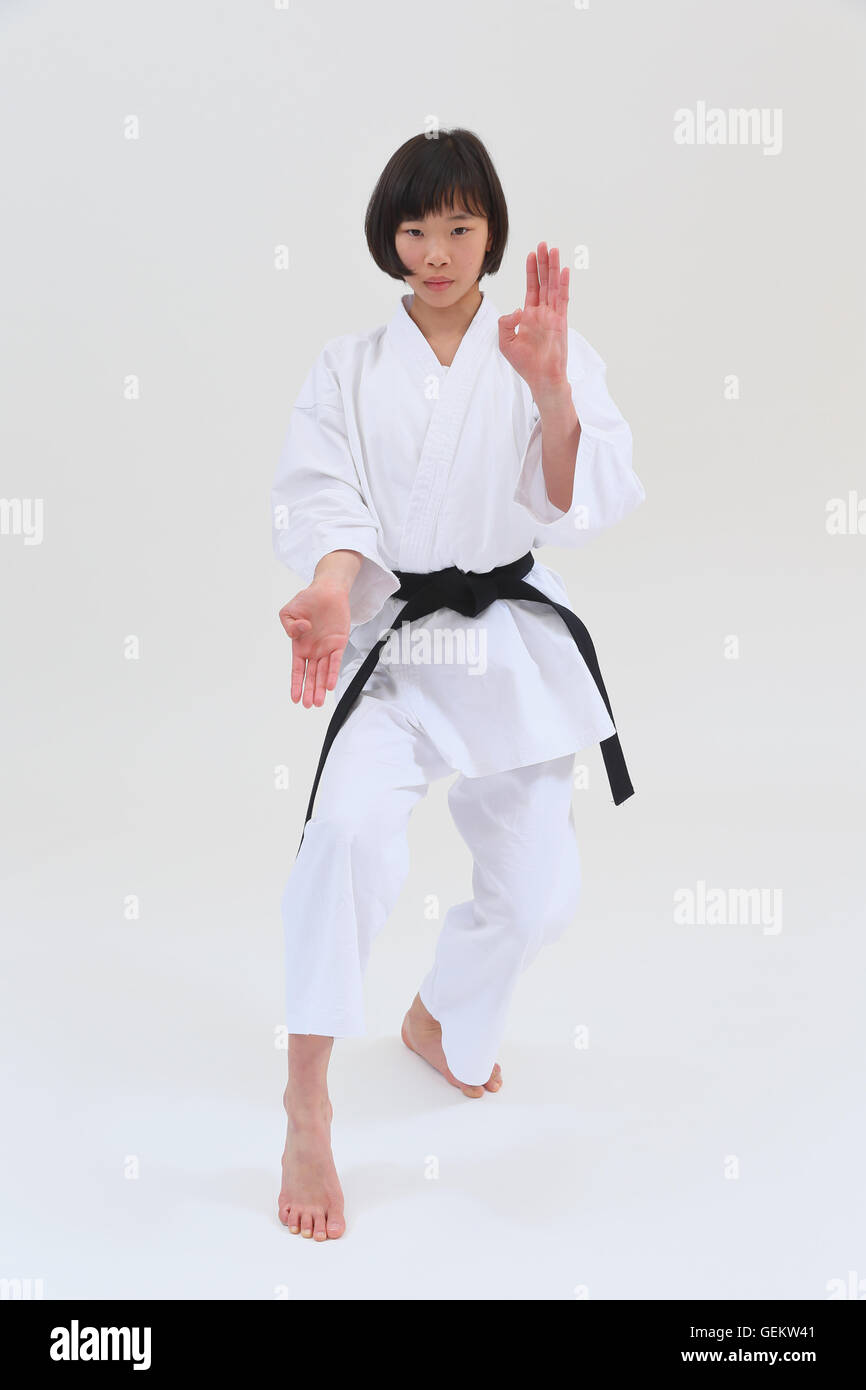 Japanese kid in karate uniform on white background Stock Photo Alamy