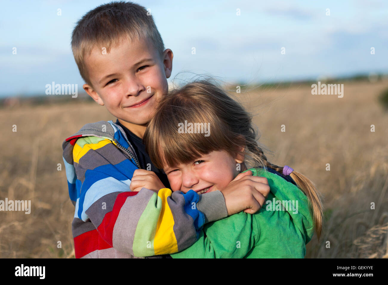 Two children brother and sister hugging Stock Photo