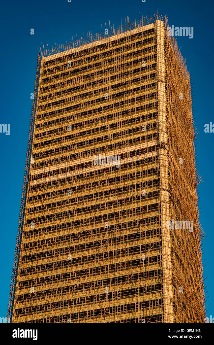 Entire building covered with bamboo scaffolding, Hong Kong, China. Stock Photo