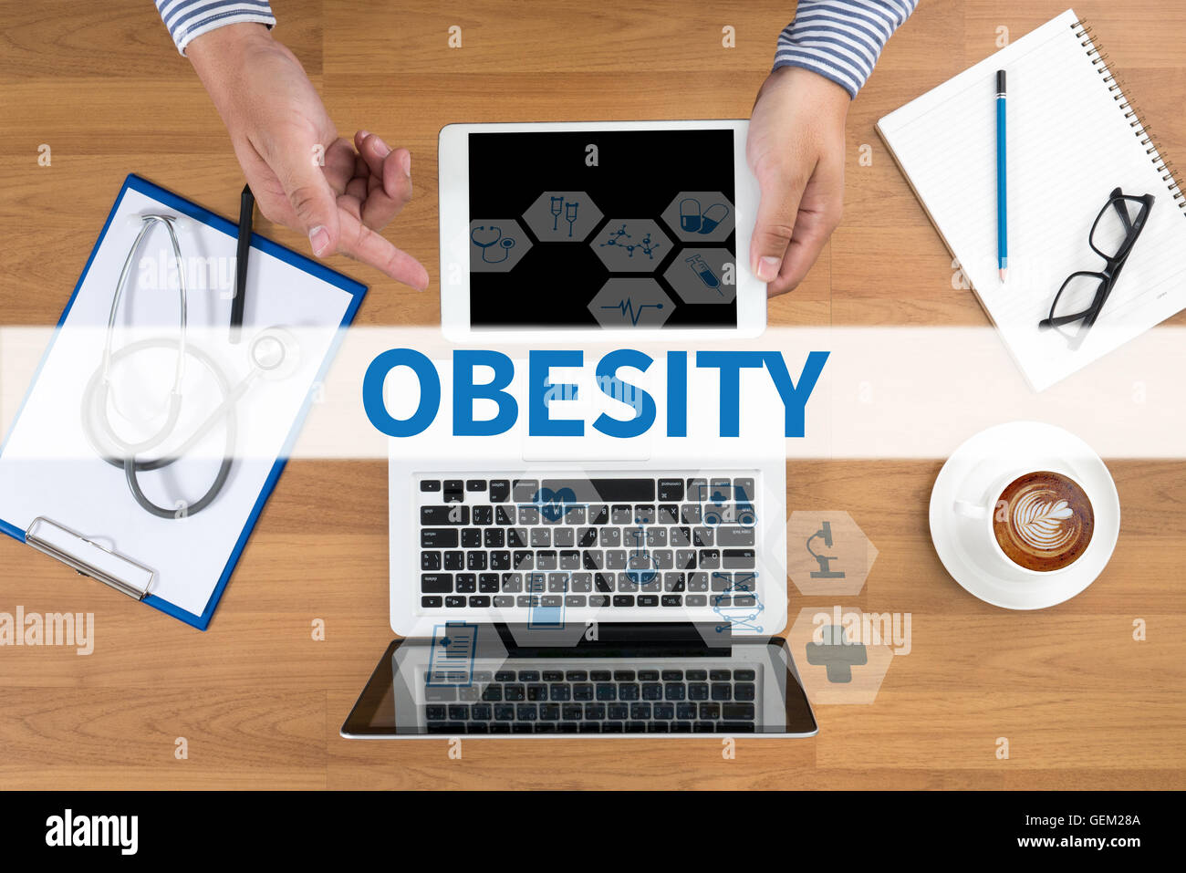 OBESITY Doctor touch digital tablet, desktop with medical equipment on background, top view, coffee Stock Photo