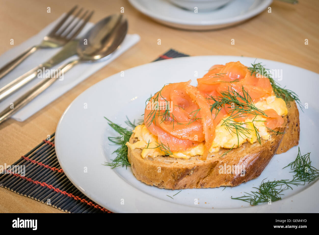 Smoked salmon with scrambled eggs on toast Stock Photo Alamy