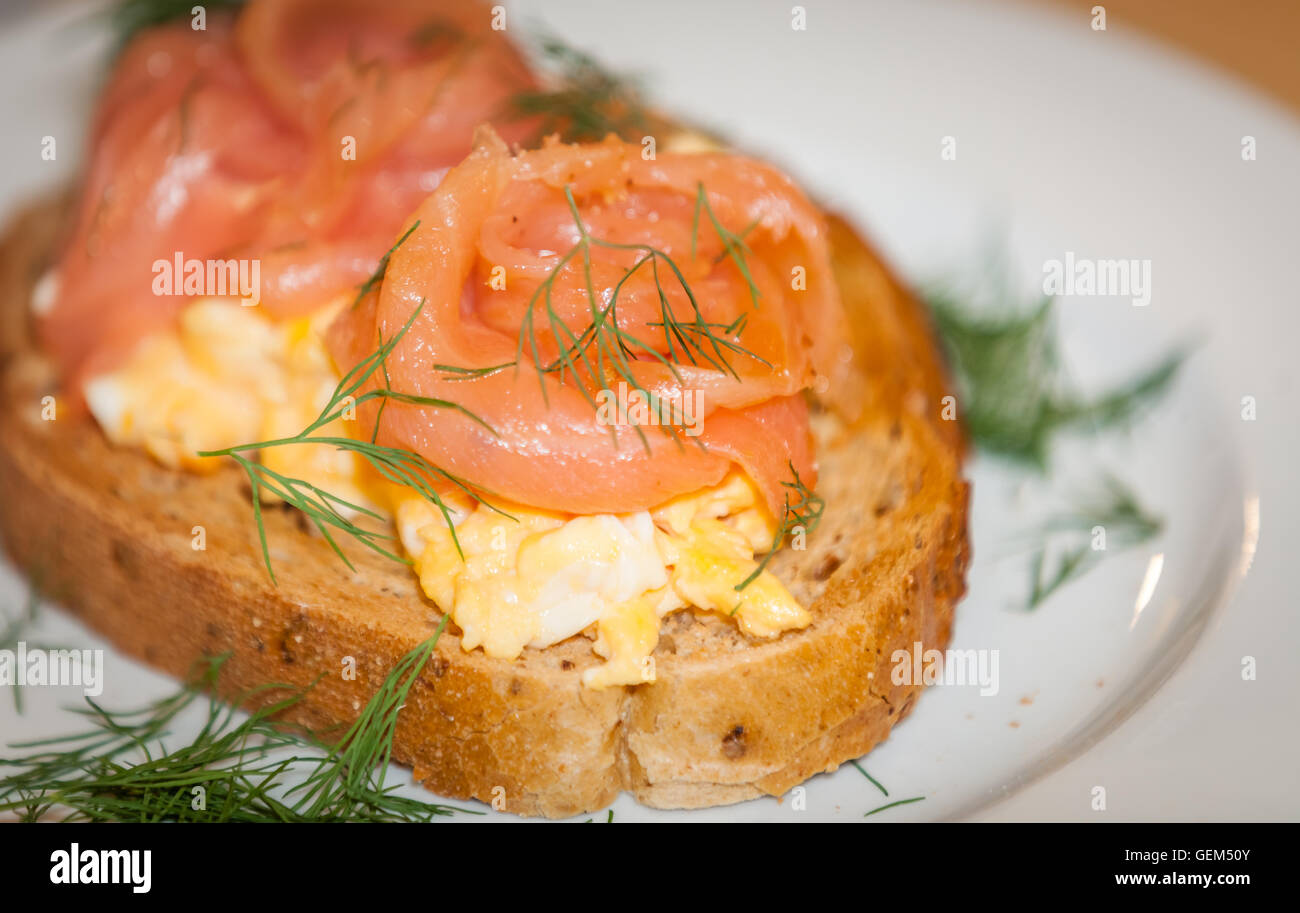 Smoked salmon with scrambled eggs on toast Stock Photo Alamy