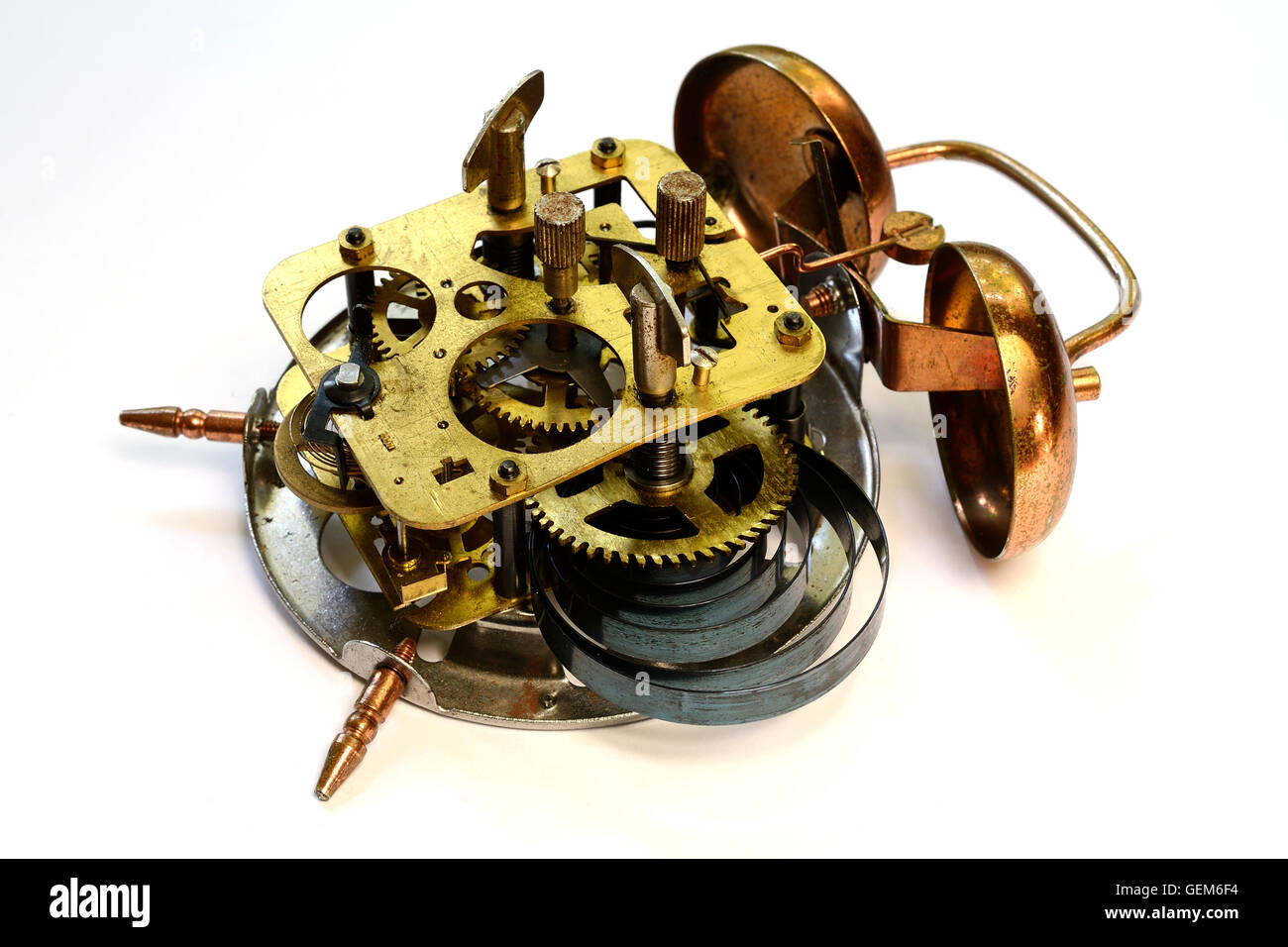 mechanism of old vintage alarm clock on a white background Stock Photo