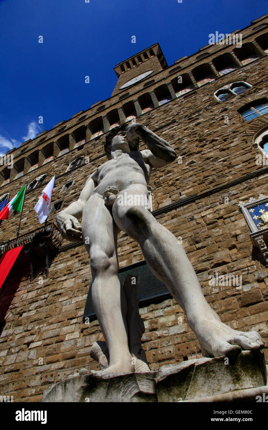 Italy,Tuscany,Florence, the copy of David of Michelangelo in Signoria square and Palazzo Vecchio. Stock Photo