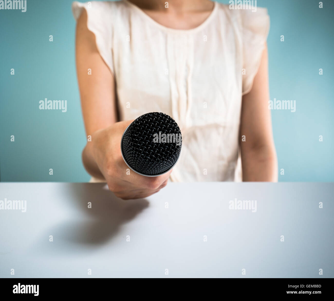 Woman holding microphone Stock Photo