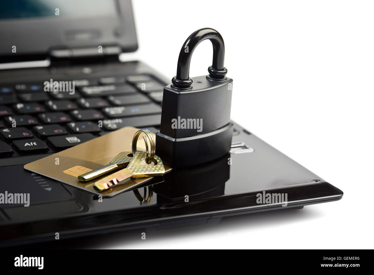 Data security concept with padlock key on laptop computer keyboard and credit card Stock Photo