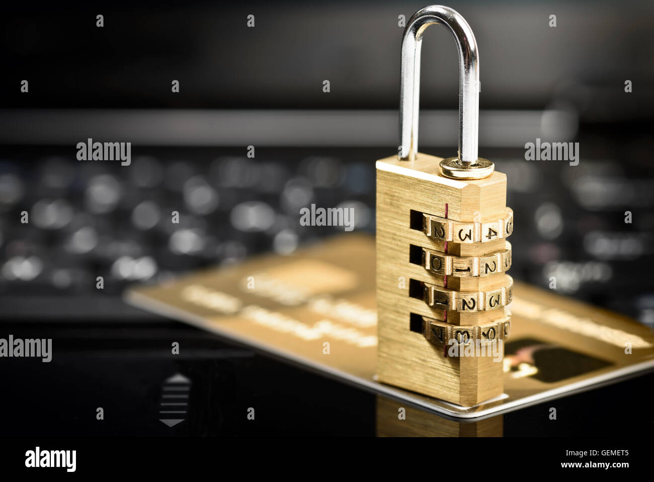 Data security concept with padlock on laptop computer keyboard and credit card Stock Photo