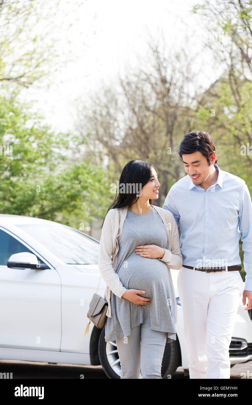 Happy pregnant Chinese woman and her husband Stock Photo