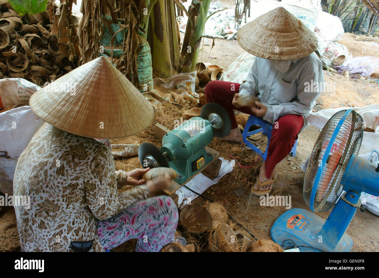 Asian worker working at wood Vietnamese make product from