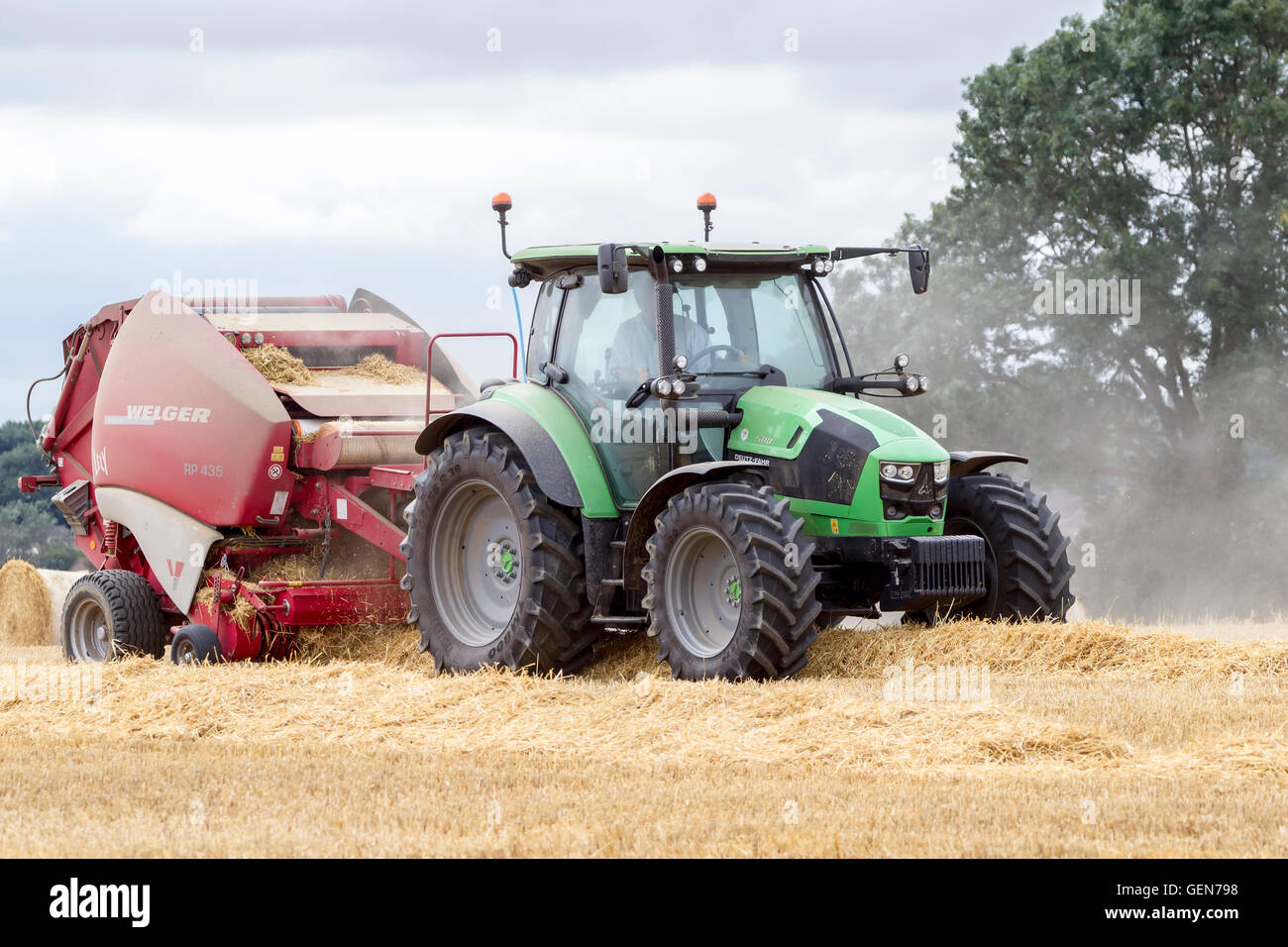 Deutz-Fahr tractor and Lely  Welger RP435 Baler working near Ecton, Northamptonshire. Stock Photo