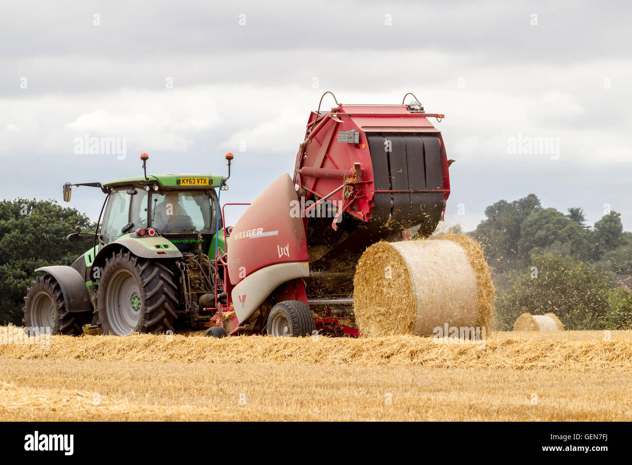 Deutz-Fahr tractor and Lely  Welger RP435 Baler working near Ecton, Northamptonshire. Stock Photo