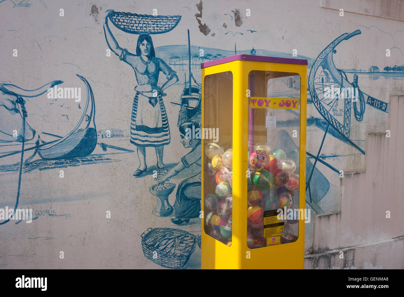 Traditional seaside imagery and contemporary toy dispenser in Barra, Costa Nova, Aveiro, Portugal. Stock Photo