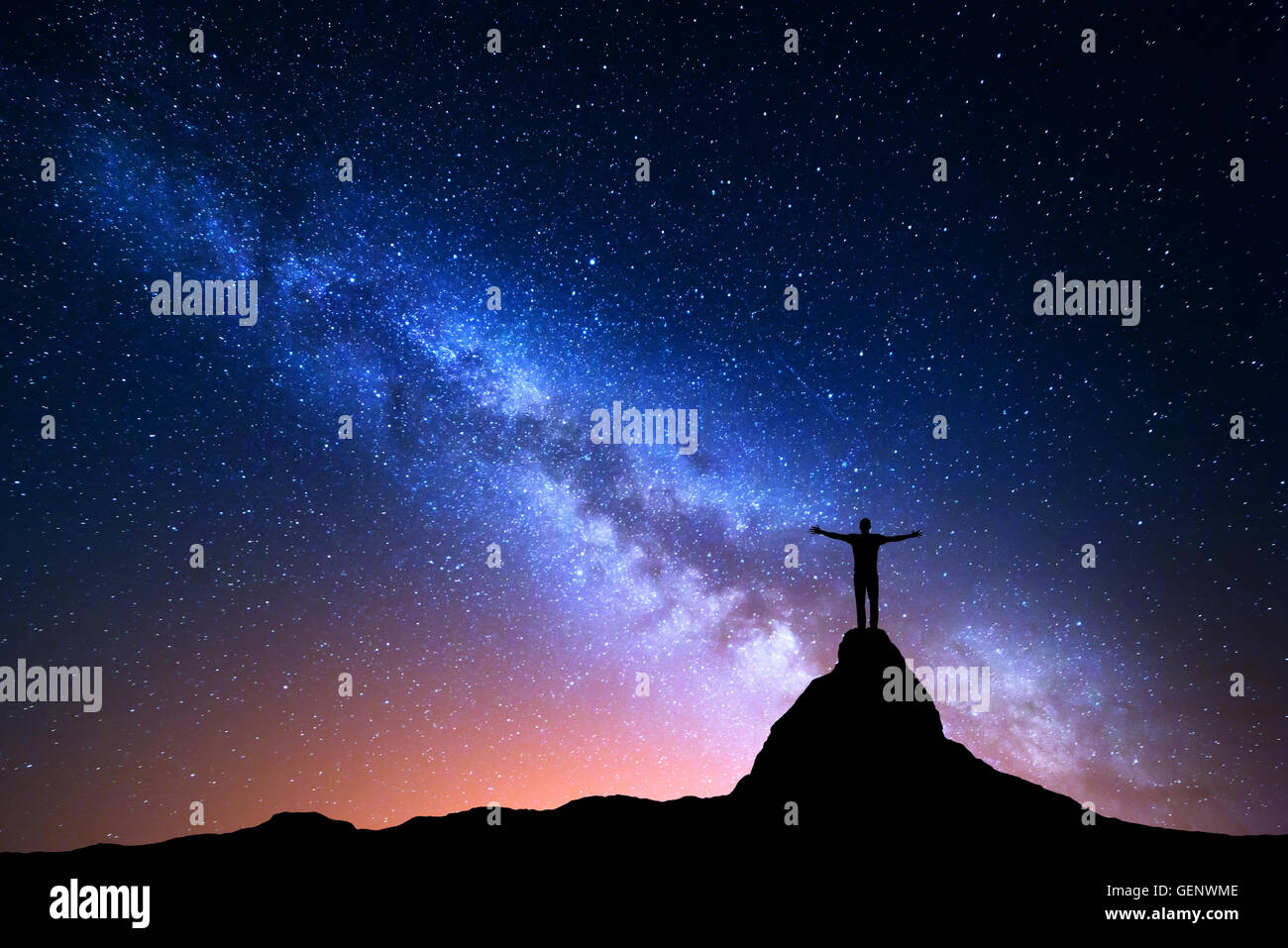 Night landscape with Milky Way. Silhouette of a standing man with ...