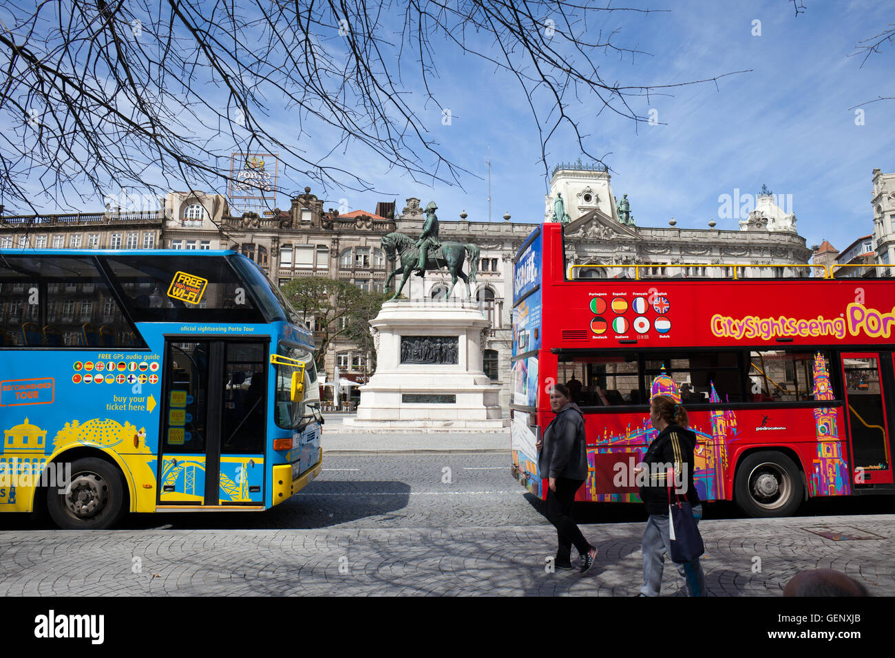 Porto, Portugal, hop-on hop-off city sightseeing tour buses at Praca Liberdade avenue in city centre, monument to King Pedro IV Stock Photo