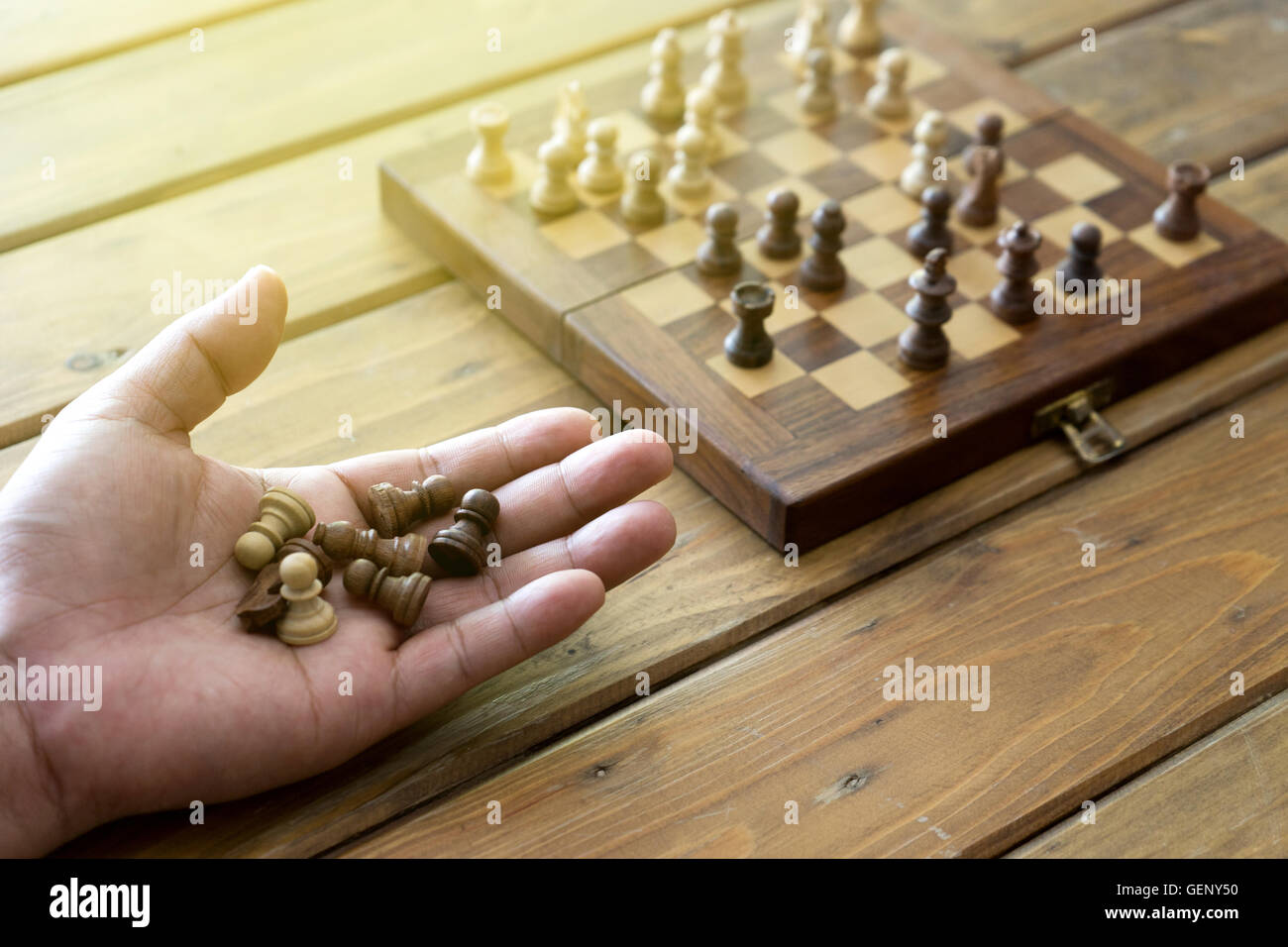 Hand holding chess piece in hi-res stock photography and images - Alamy